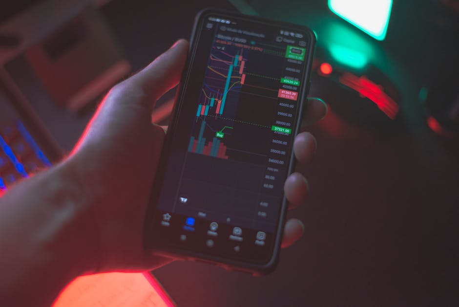 Tampilan layar monitor yang menunjukkan chart candlestick Forex dengan indikator Moving Average dan volume trading yang mendetail di ruangan kantor modern.